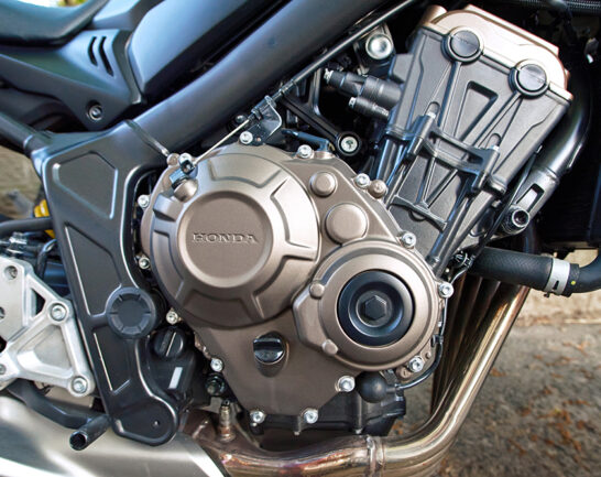 Minsk, Belarus. Apr 27, 2024. Honda motorcycle engine close up. Chrome motorcycle engine block